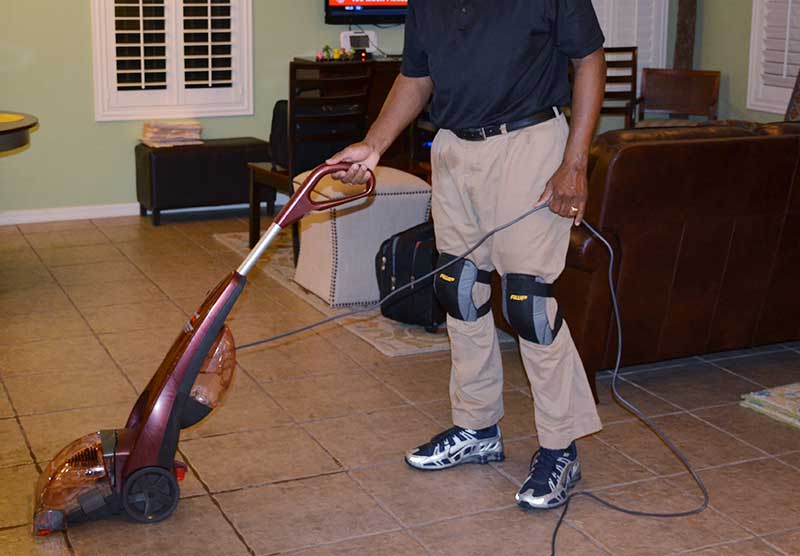 cleaning the floor with a floor cleaning machine